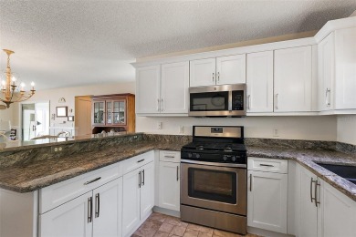 GORGEOUS, TURNKEY 2/2 Loredo with ENCLOSED, CLIMATE-CONTROLLED on The Links of Spruce Creek in Florida - for sale on GolfHomes.com, golf home, golf lot