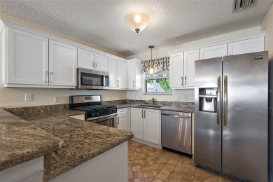 GORGEOUS, TURNKEY 2/2 Loredo with ENCLOSED, CLIMATE-CONTROLLED on The Links of Spruce Creek in Florida - for sale on GolfHomes.com, golf home, golf lot