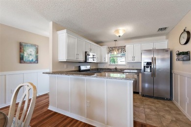 GORGEOUS, TURNKEY 2/2 Loredo with ENCLOSED, CLIMATE-CONTROLLED on The Links of Spruce Creek in Florida - for sale on GolfHomes.com, golf home, golf lot
