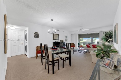 Experience effortless elegance in this first-floor 2-bedroom on Sunrise Lakes Phase IV Golf Course in Florida - for sale on GolfHomes.com, golf home, golf lot