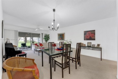 Experience effortless elegance in this first-floor 2-bedroom on Sunrise Lakes Phase IV Golf Course in Florida - for sale on GolfHomes.com, golf home, golf lot