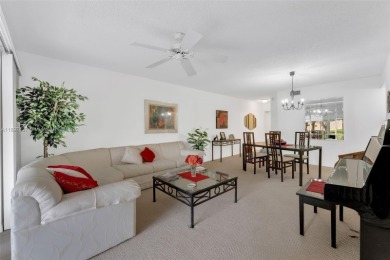 Experience effortless elegance in this first-floor 2-bedroom on Sunrise Lakes Phase IV Golf Course in Florida - for sale on GolfHomes.com, golf home, golf lot