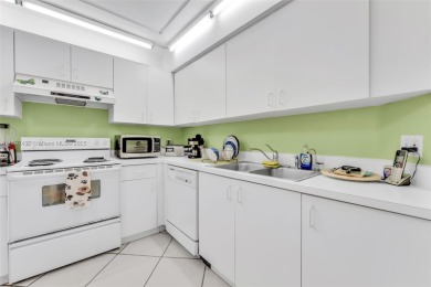 Experience effortless elegance in this first-floor 2-bedroom on Sunrise Lakes Phase IV Golf Course in Florida - for sale on GolfHomes.com, golf home, golf lot