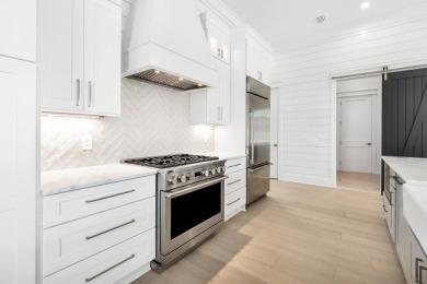 This exceptional Topsail Plan by Cole Construction offers luxury on Origins Golf Club in Florida - for sale on GolfHomes.com, golf home, golf lot