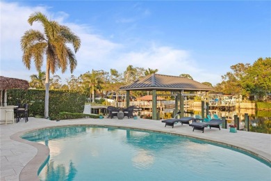 Experience the pinnacle of waterfront living in Dana Shores on Rocky Point Golf Course in Florida - for sale on GolfHomes.com, golf home, golf lot