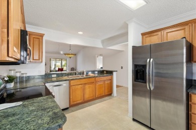 This beautiful Wisteria Style Designer Home in the Village of on Glenview Championship Golf and Country Club in Florida - for sale on GolfHomes.com, golf home, golf lot