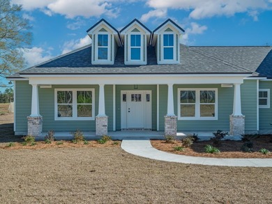 Move-in Ready! Exquisite new construction overlooking hole 6 of on Wildwood Country Club in Florida - for sale on GolfHomes.com, golf home, golf lot