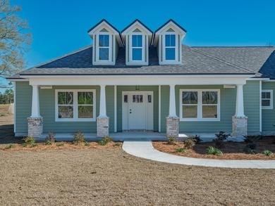Move-in Ready! Exquisite new construction overlooking hole 6 of on Wildwood Country Club in Florida - for sale on GolfHomes.com, golf home, golf lot