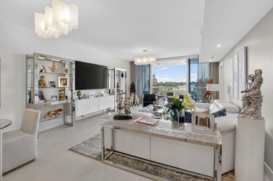 Dazzling golf and sparkling lake views await in this stunning on Boca West Golf and Country Club in Florida - for sale on GolfHomes.com, golf home, golf lot