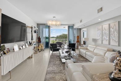 Dazzling golf and sparkling lake views await in this stunning on Boca West Golf and Country Club in Florida - for sale on GolfHomes.com, golf home, golf lot