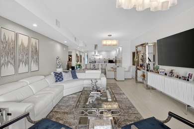 Dazzling golf and sparkling lake views await in this stunning on Boca West Golf and Country Club in Florida - for sale on GolfHomes.com, golf home, golf lot