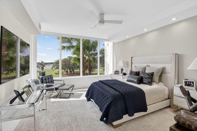 Dazzling golf and sparkling lake views await in this stunning on Boca West Golf and Country Club in Florida - for sale on GolfHomes.com, golf home, golf lot