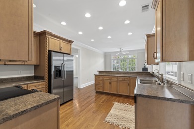 Charming 3-bedroom, 2.5-bath home located in the desirable on Harbor Club Golf and Country Club in Georgia - for sale on GolfHomes.com, golf home, golf lot