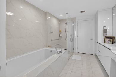 Dazzling golf and sparkling lake views await in this stunning on Boca West Golf and Country Club in Florida - for sale on GolfHomes.com, golf home, golf lot