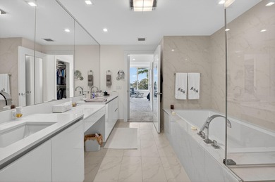 Dazzling golf and sparkling lake views await in this stunning on Boca West Golf and Country Club in Florida - for sale on GolfHomes.com, golf home, golf lot