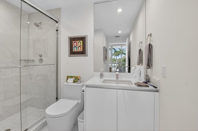 Dazzling golf and sparkling lake views await in this stunning on Boca West Golf and Country Club in Florida - for sale on GolfHomes.com, golf home, golf lot