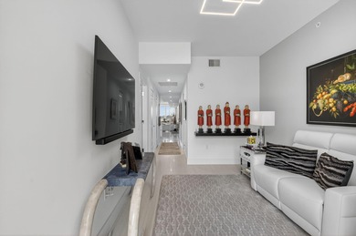 Dazzling golf and sparkling lake views await in this stunning on Boca West Golf and Country Club in Florida - for sale on GolfHomes.com, golf home, golf lot