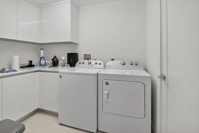 Dazzling golf and sparkling lake views await in this stunning on Boca West Golf and Country Club in Florida - for sale on GolfHomes.com, golf home, golf lot