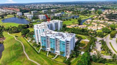 Dazzling golf and sparkling lake views await in this stunning on Boca West Golf and Country Club in Florida - for sale on GolfHomes.com, golf home, golf lot