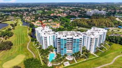 Dazzling golf and sparkling lake views await in this stunning on Boca West Golf and Country Club in Florida - for sale on GolfHomes.com, golf home, golf lot