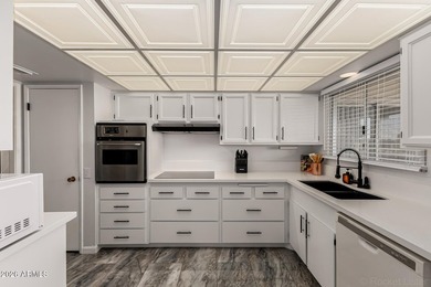 This beautifully updated Sun City home is perfectly situated on on Quail Run Golf Course in Arizona - for sale on GolfHomes.com, golf home, golf lot