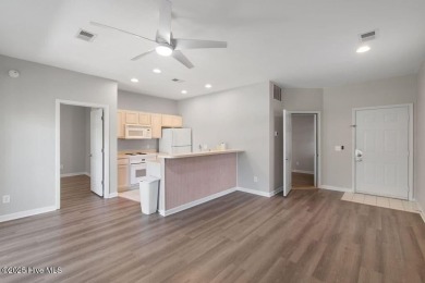 This third floor Royal Poste golf front condo in the vibrant on Sea Trail Golf Resort in North Carolina - for sale on GolfHomes.com, golf home, golf lot