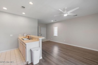This third floor Royal Poste golf front condo in the vibrant on Sea Trail Golf Resort in North Carolina - for sale on GolfHomes.com, golf home, golf lot