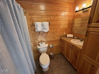 Charming Mountain Cabin with Views, Hot Tub & STR Income on Bent Creek Golf Course in Tennessee - for sale on GolfHomes.com, golf home, golf lot