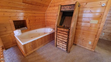 Charming Mountain Cabin with Views, Hot Tub & STR Income on Bent Creek Golf Course in Tennessee - for sale on GolfHomes.com, golf home, golf lot