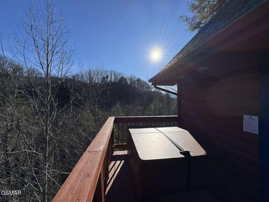 Charming Mountain Cabin with Views, Hot Tub & STR Income on Bent Creek Golf Course in Tennessee - for sale on GolfHomes.com, golf home, golf lot