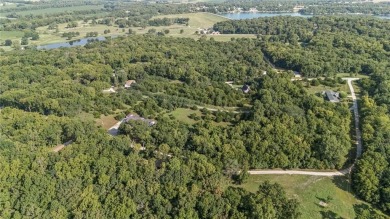 Tucked away in the private, gated community of Linn Valley Lakes on Linn Valley Lakes - Deer Trace Golf Course in Kansas - for sale on GolfHomes.com, golf home, golf lot