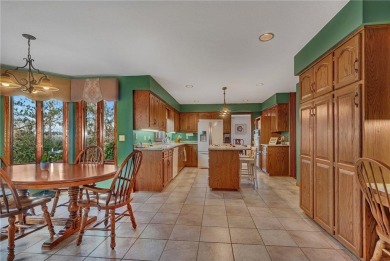 This walkout two-story home sits on a 1/2 acre treed lot and has on St. Cloud Country Club in Minnesota - for sale on GolfHomes.com, golf home, golf lot