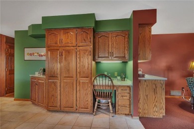 This walkout two-story home sits on a 1/2 acre treed lot and has on St. Cloud Country Club in Minnesota - for sale on GolfHomes.com, golf home, golf lot