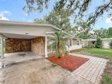 Discover this beautifully renovated 4-bedroom, 2-bathroom home on Temple Terrace Golf and Country Club in Florida - for sale on GolfHomes.com, golf home, golf lot