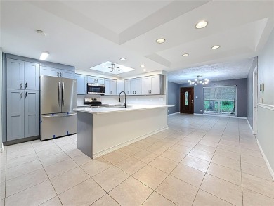 Discover this beautifully renovated 4-bedroom, 2-bathroom home on Temple Terrace Golf and Country Club in Florida - for sale on GolfHomes.com, golf home, golf lot