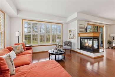 Spacious two-bedroom, two bathroom condo has walls of windows in on The Chaska Par 30 Golf Course in Minnesota - for sale on GolfHomes.com, golf home, golf lot