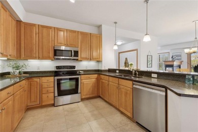 Spacious two-bedroom, two bathroom condo has walls of windows in on The Chaska Par 30 Golf Course in Minnesota - for sale on GolfHomes.com, golf home, golf lot