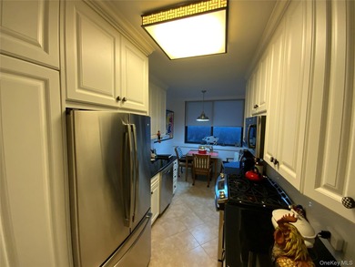 Long, wide and dramatic living room, formal dining room, gourmet on Towers Country Club in New York - for sale on GolfHomes.com, golf home, golf lot