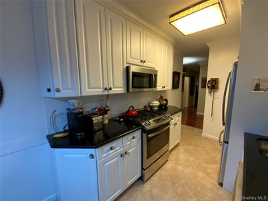 Long, wide and dramatic living room, formal dining room, gourmet on Towers Country Club in New York - for sale on GolfHomes.com, golf home, golf lot