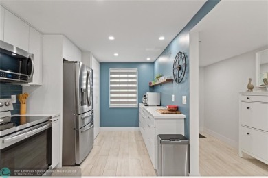 Beautifully renovated, spacious residence with large, screened on Palm-Aire Country Club and Resort - Palms in Florida - for sale on GolfHomes.com, golf home, golf lot