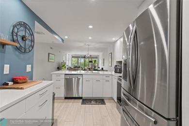 Beautifully renovated, spacious residence with large, screened on Palm-Aire Country Club and Resort - Palms in Florida - for sale on GolfHomes.com, golf home, golf lot