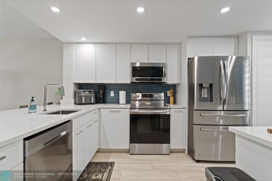 Beautifully renovated, spacious residence with large, screened on Palm-Aire Country Club and Resort - Palms in Florida - for sale on GolfHomes.com, golf home, golf lot