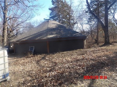 Lovely Octagon cabin at Sugar Valley Lake, home is located on 2 on Sugar Valley Lakes Golf Course in Kansas - for sale on GolfHomes.com, golf home, golf lot