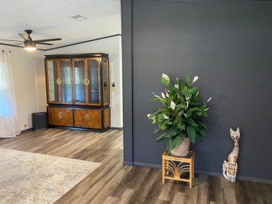 Lovely 2/2 in vibrant 55+ lease hold ($844) community. Wall of on Spanish Lakes Fairways in Florida - for sale on GolfHomes.com, golf home, golf lot