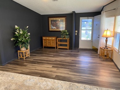 Lovely 2/2 in vibrant 55+ lease hold ($844) community. Wall of on Spanish Lakes Fairways in Florida - for sale on GolfHomes.com, golf home, golf lot