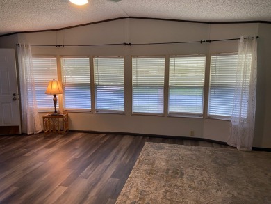 Lovely 2/2 in vibrant 55+ lease hold ($844) community. Wall of on Spanish Lakes Fairways in Florida - for sale on GolfHomes.com, golf home, golf lot