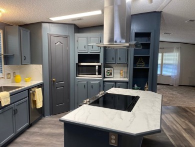 Lovely 2/2 in vibrant 55+ lease hold ($844) community. Wall of on Spanish Lakes Fairways in Florida - for sale on GolfHomes.com, golf home, golf lot