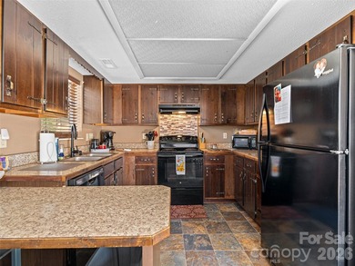 Positioned above Maggie Valley Club & Resort, this 2 bedroom, 2 on Maggie Valley Resort and Country Club in North Carolina - for sale on GolfHomes.com, golf home, golf lot