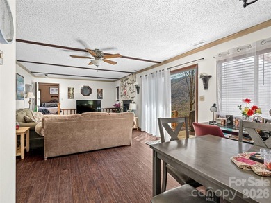 Positioned above Maggie Valley Club & Resort, this 2 bedroom, 2 on Maggie Valley Resort and Country Club in North Carolina - for sale on GolfHomes.com, golf home, golf lot