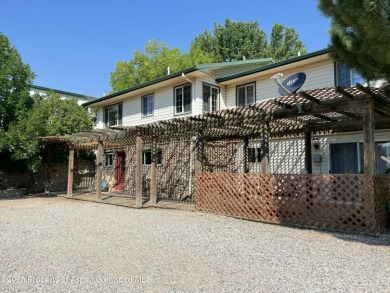 Coined ''America's Most Trusted Horseman'', John Lyons and his on Battlement Mesa Golf Course in Colorado - for sale on GolfHomes.com, golf home, golf lot